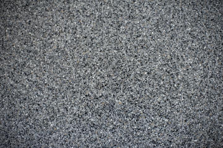 Close up Textured Gray Conglomerate Stone for Wallpaper Backgrounds, Emphasizing Copy Space.