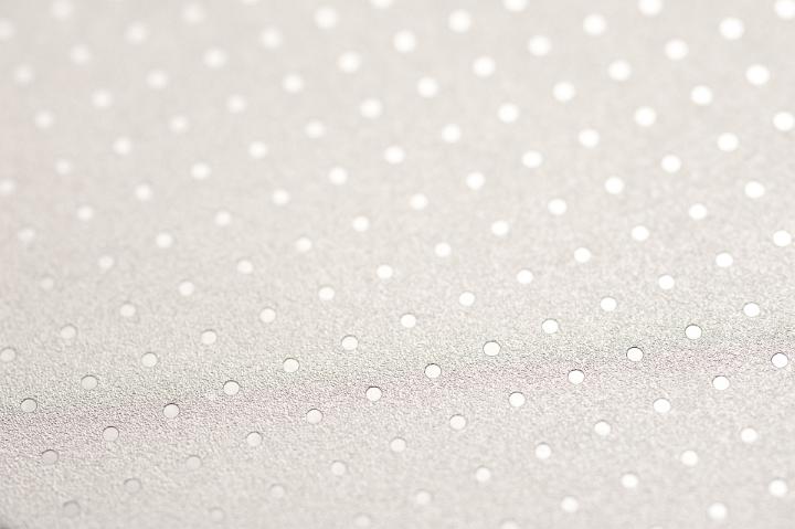 White spotted backdrop pattern of angled white spots in a grid array format