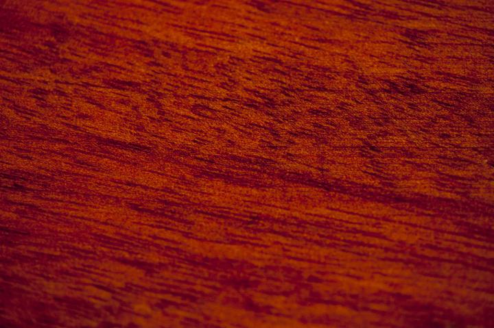 rich red surface texture of polished wood