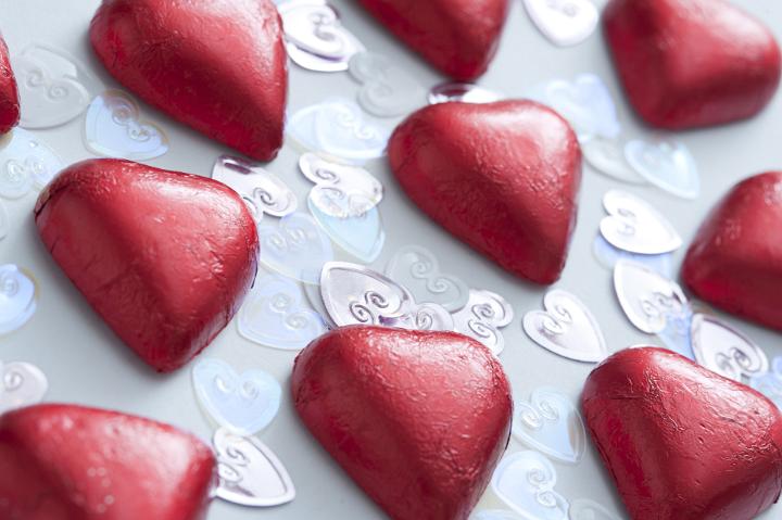 Rows of valentine heart-shaped chocolates in close-up