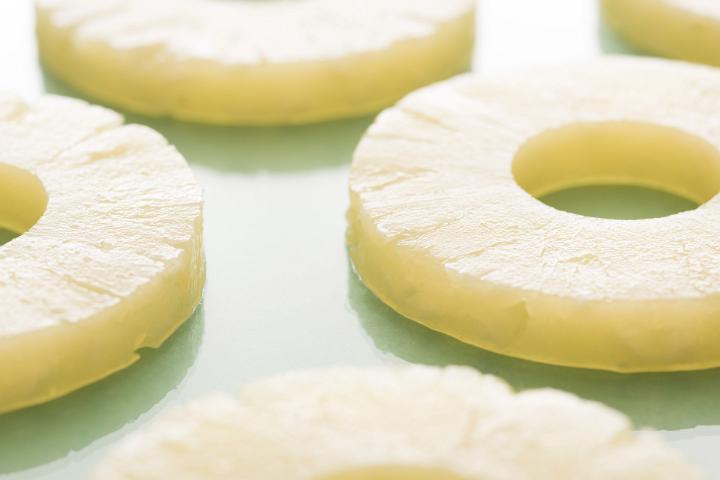 Pineapple pieces cut in slices in close-up
