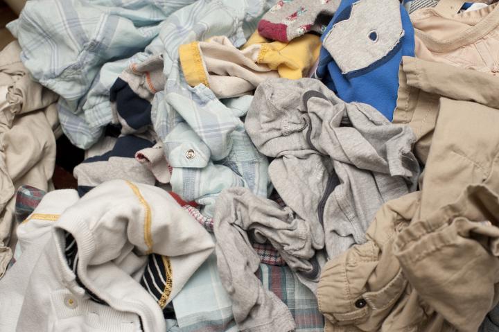 Background texture of a pile of dirty laundry or washing with jumbled clothing