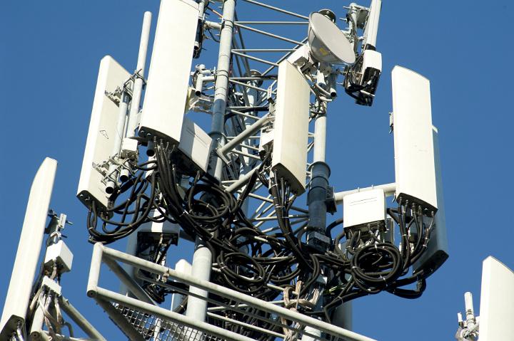 Close Up of Telephone Communications Tower Against Blue Sky