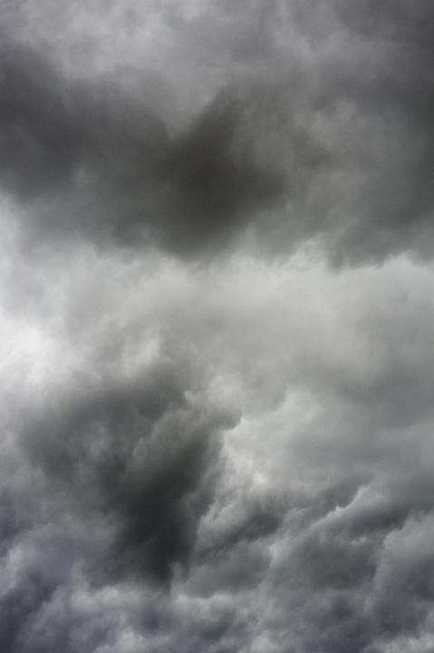 Overcast gray sky with heavy dark clouds, forecasting stormy weather