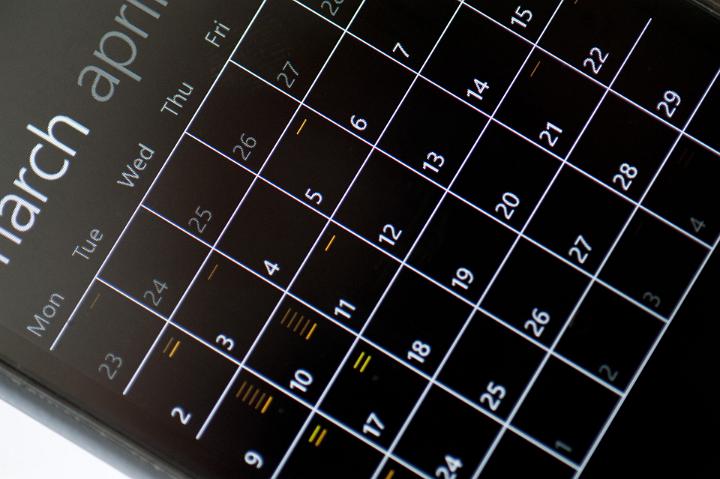 Close up view from above of the blank telephone appointments calendar for the month of March showing the individual days in a time management concept