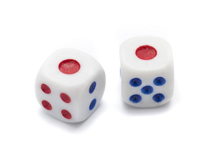 Close up Two Rolling Snake Eyes Dice with Blue and Red Markings, Isolated on White Background