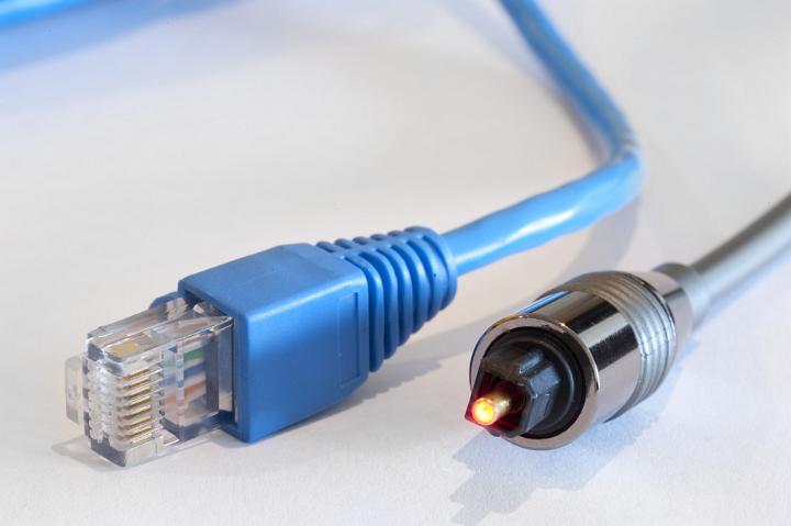 two data networking cables, one optical and one copper twisted pair ethernet