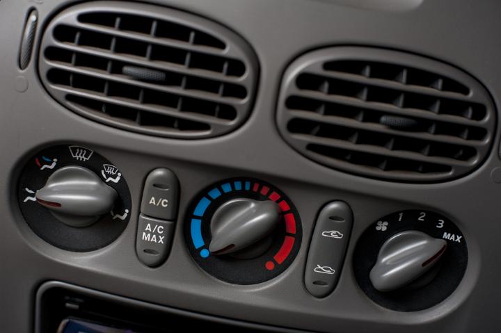 Close Up of Vehicle Dashboard Showing Detail of Climate Controls and Vents