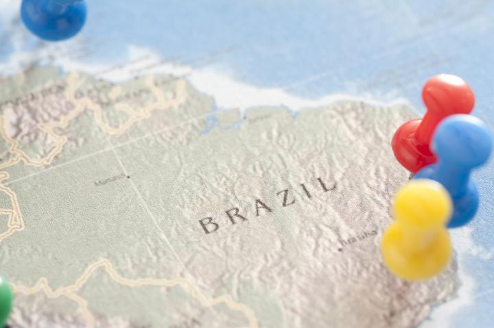 Close Up of Colorful Tacks Pinned into Various Locations on Map of Brazil, Travel Themed Planning