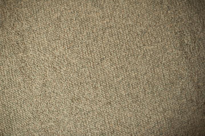 Details of Textured Beige Carpet for Wallpaper Backgrounds, Emphasizing Copy Space.