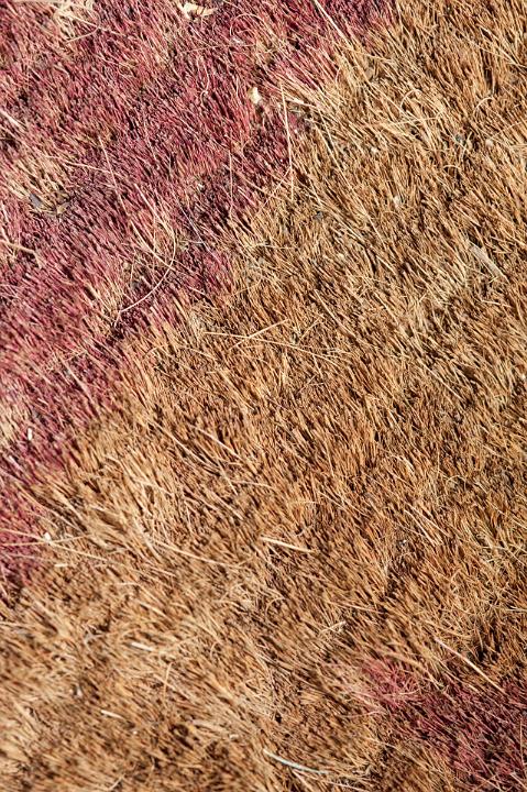 Background texture of rough durable coir matting made from the natural fibre of the coconut husk, full frame