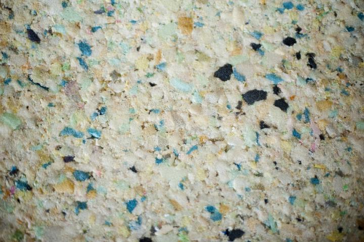 Background texture of recycled foam showing the colorful chips of the components in a new matrix