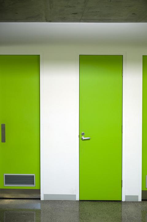 Yellow Green Single Doors Inside an Empty Architectural Building.