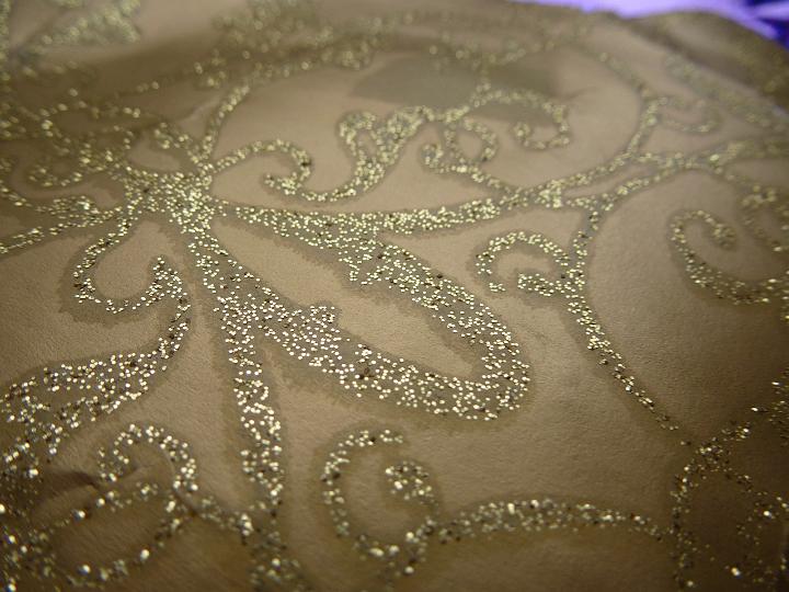 Close up Artistic Glittering Gold Design on Brown Background for Backdrop.