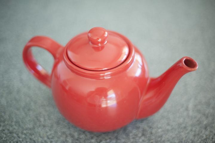 Still Life of Red Teapot on Counter Top as seen from Above
