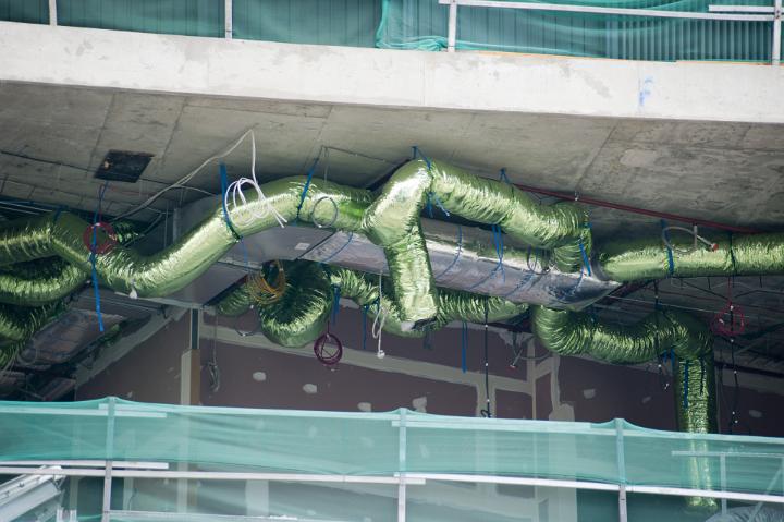 Installing Green Air Conditioning Duct Work of a Commerical Building