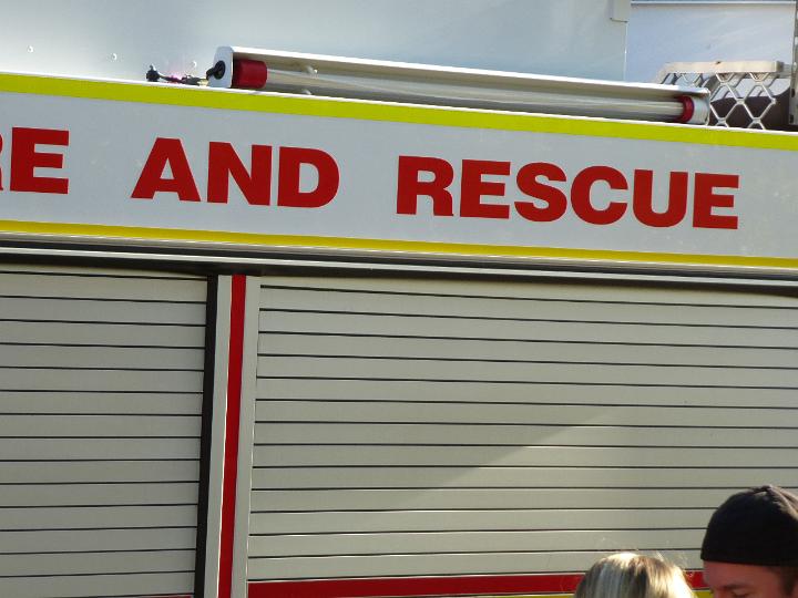 Fire and Rescue storage garages at the station or depot with a big overhead sign above the closed doors, close up view