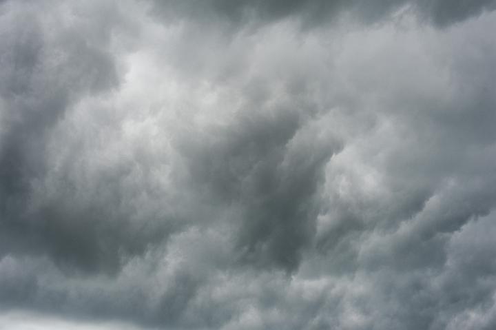 Full frame nature background of a stormy sky with ominous grey clouds for weather themed concepts