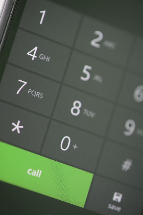 Close up Green Call Button on a Modern Touch Screen Mobile Phone