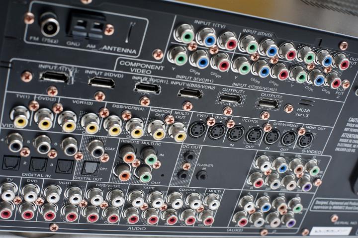 An array of connections on the back of a home theater amplifier