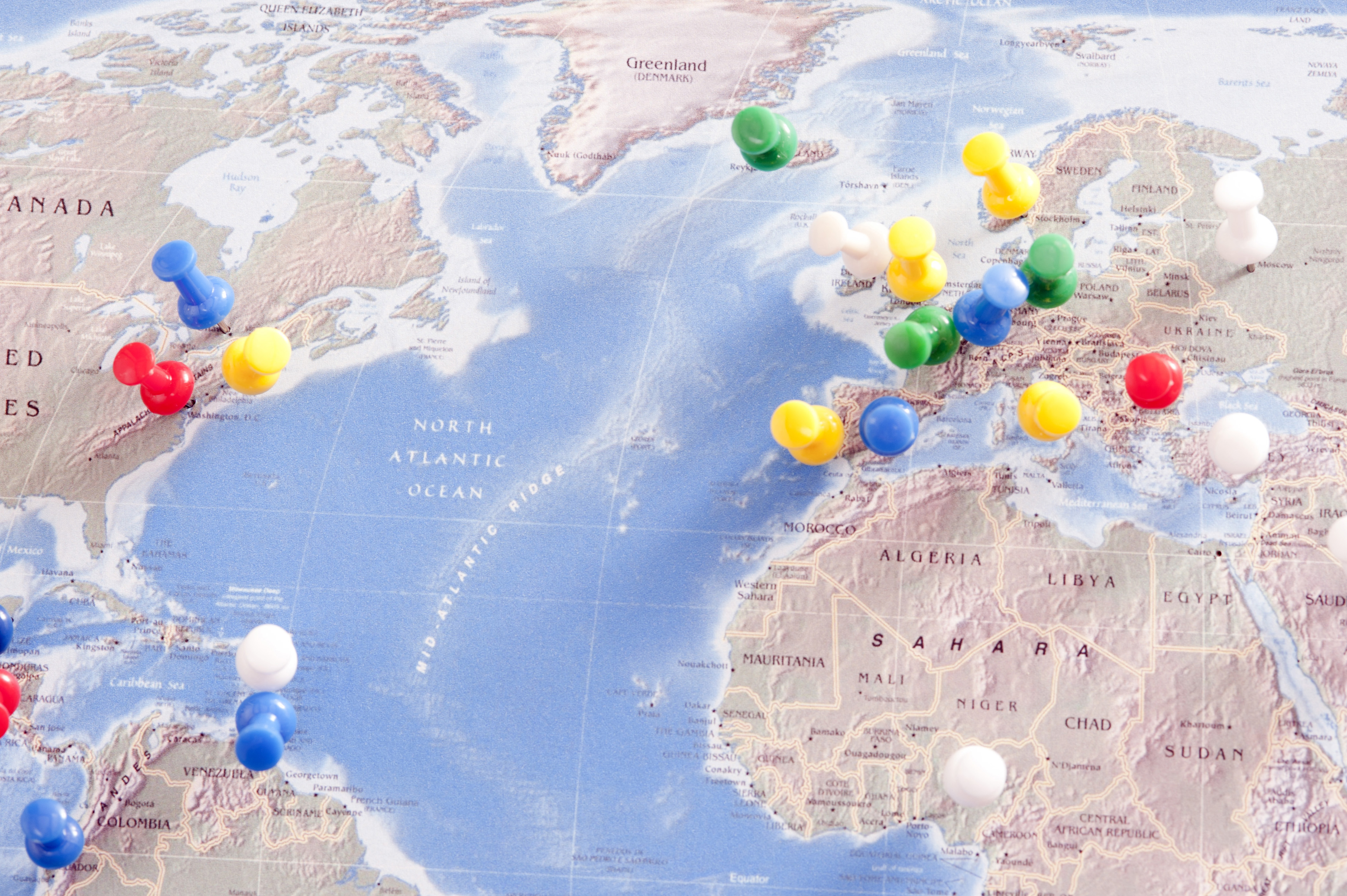 Image of Colorful Pins Locating Destinations on World Map | Freebie.Photography